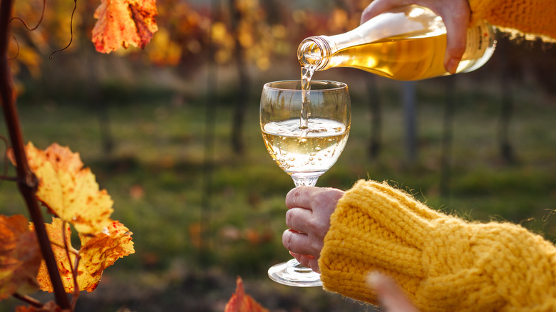 pouring sparkling wine in a glass