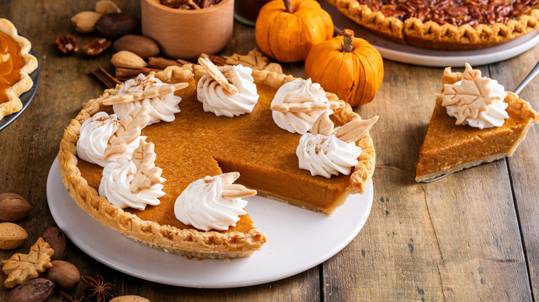 pumpkin pie with dollops of whipped cream