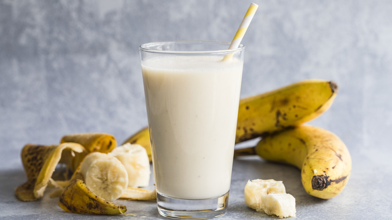 glass of banana milk and bananas