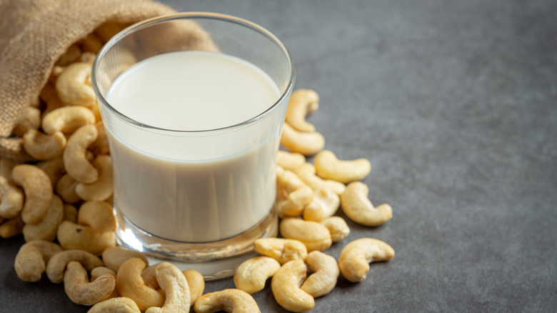 glass of cashew milk with cashews