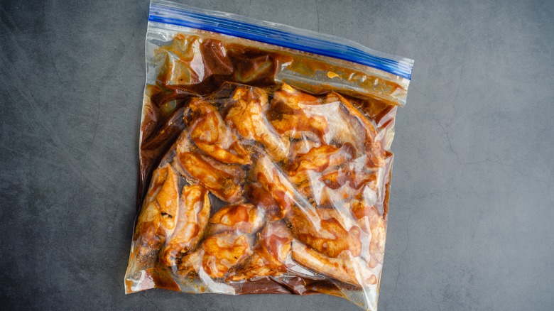 Chicken in plastic bag with seasonings