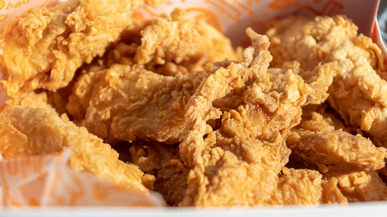 Close-up of a classic Popeyes fried chicken box