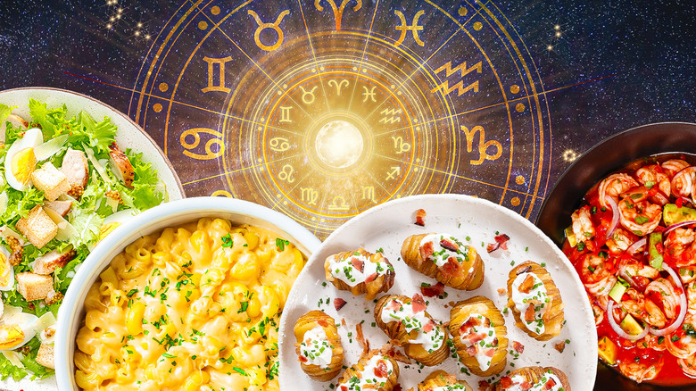 Different buffet dishes with a zodiac wheel in the background