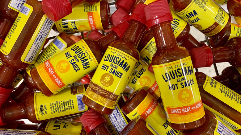 pile of Louisiana hot sauce bottles