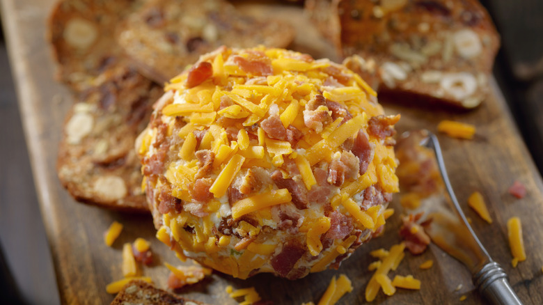 Cheese ball covered in cheddar ad dried beef