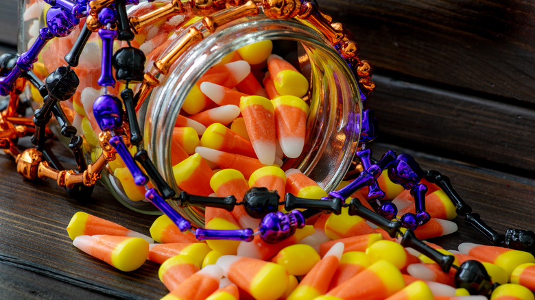 Jar spilling candy corn