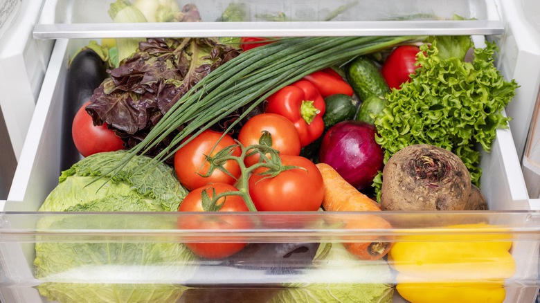 Produce stacked up in fridge drawer