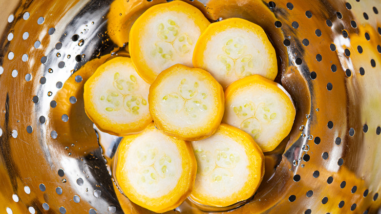 Sliced squash draining colander