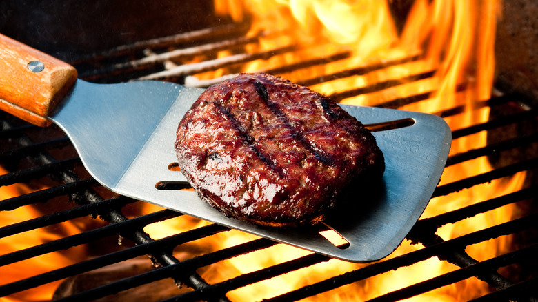 burger cooking over high heat