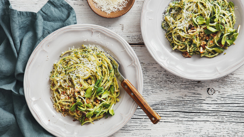 bowls of pasta with cheese and herbs