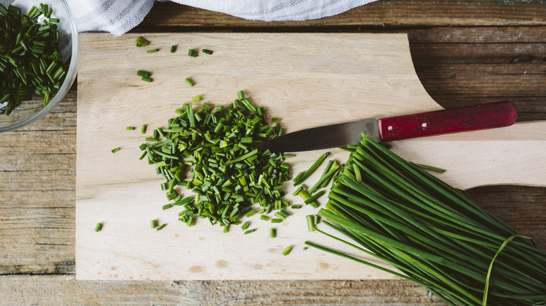 Chopped chives on board