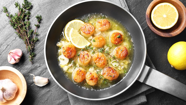 shrimp scampi with garlic in pan