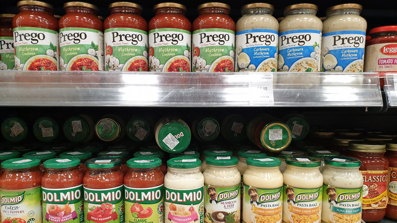 Jars of pasta sauce on shelves