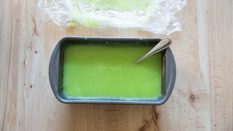 partially-frozen green sorbet in pan