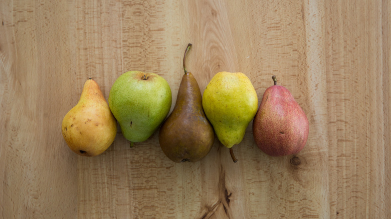 pears lined up on table