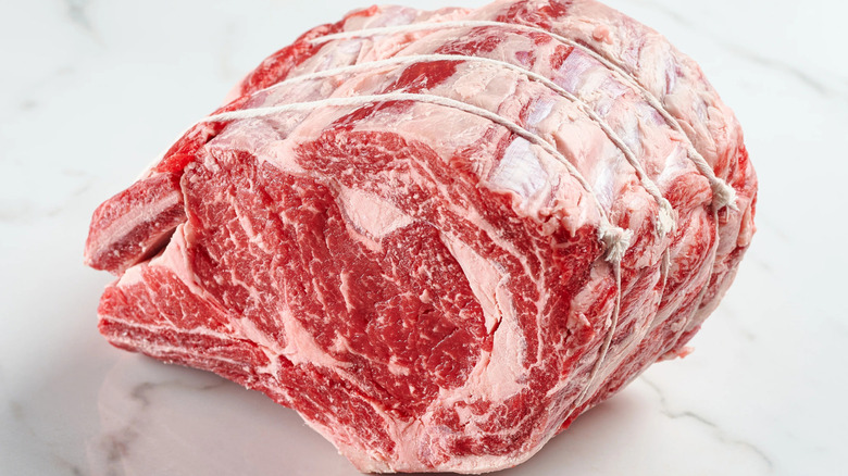 raw standing rib roast butchered with twine