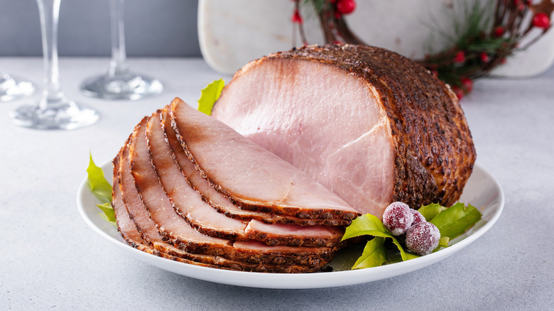 Boneless spiral ham on plate.