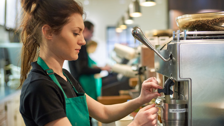 Starbucks barista frothing milk