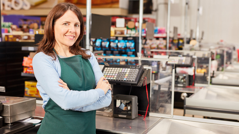 Store employee at checkout counter