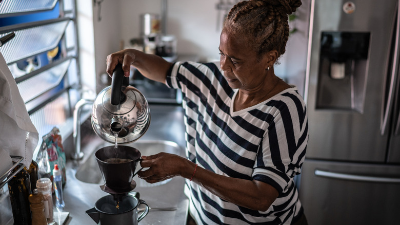 woman brewing coffee at home