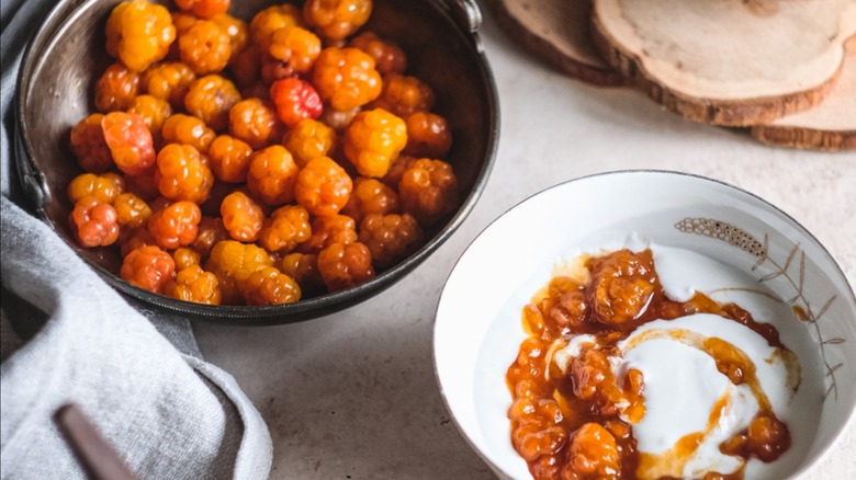 Cloudberries in a bowl with jam