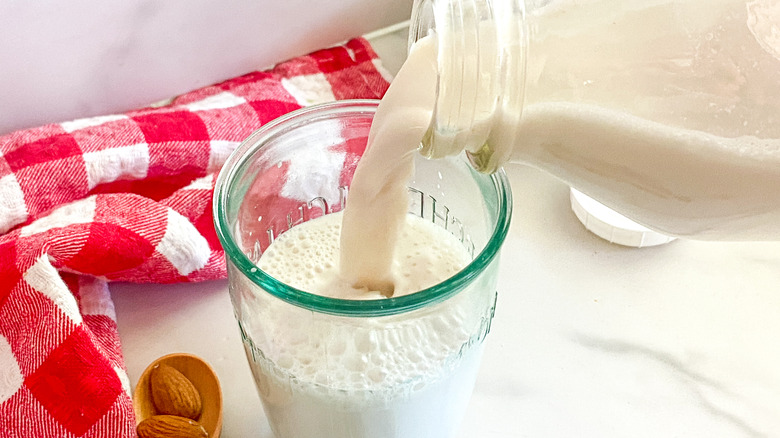 Pouring fresh almond milk