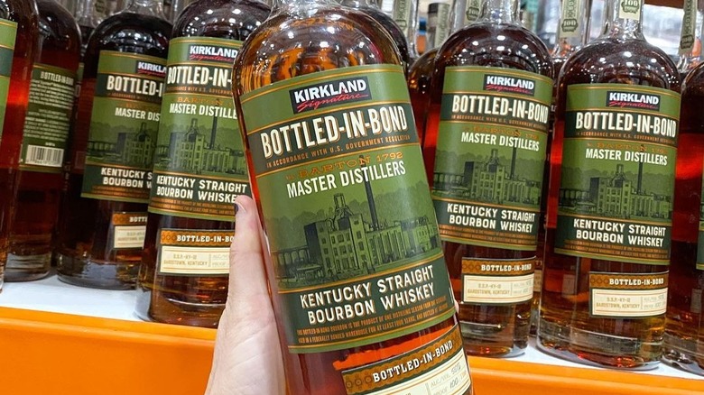Kirkland Signature Kentucky Bourbon Whiskey in hand