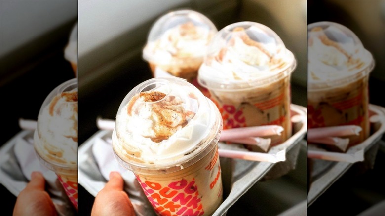 two different handheld coffee drinks