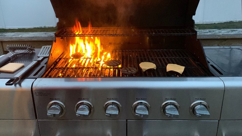 Burgers cooking on a grill
