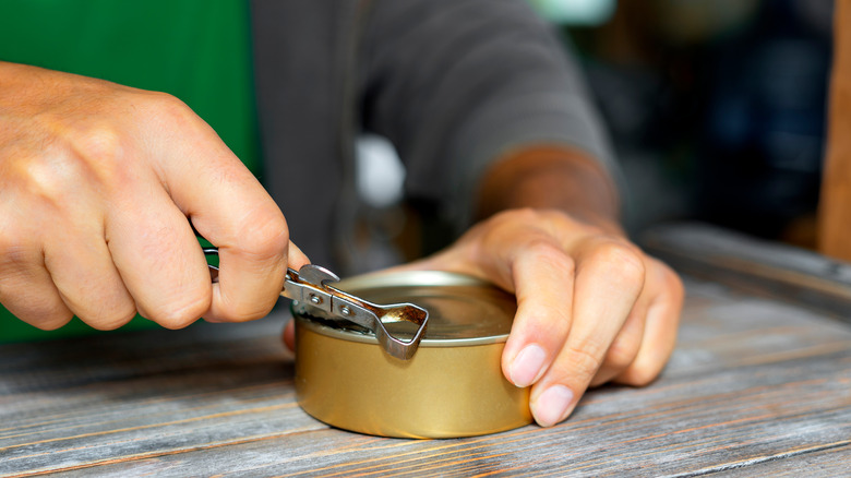 Opening can with traditional tool