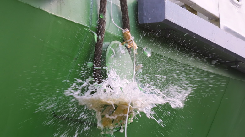 champagne bottle breaking on ship 