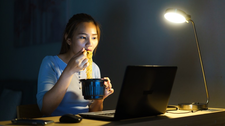 woman eating ramen