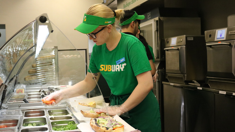 Russian Subway employee makes sandwich