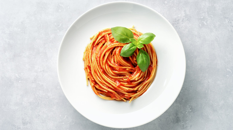 Pasta in tomato sauce on bowl