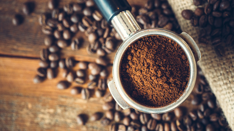 Top-down view of ground coffee in an espresso scoop