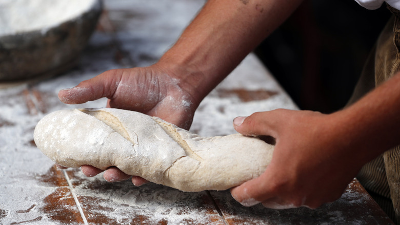 baker making baguette