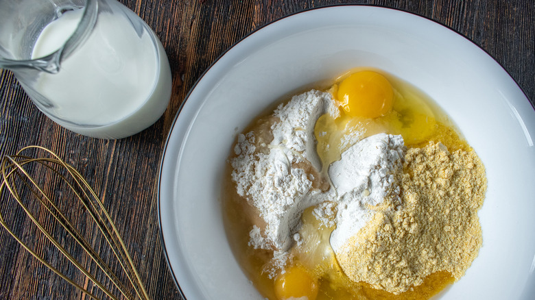 mixing bowl with flour and eggs inside