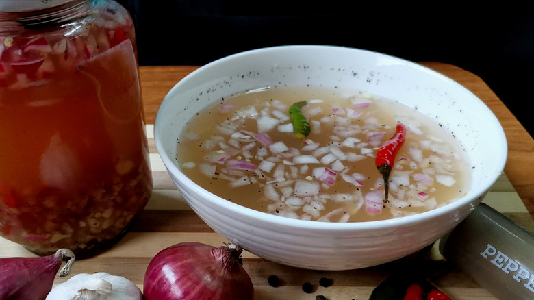 chopped ingredients in vinegar 