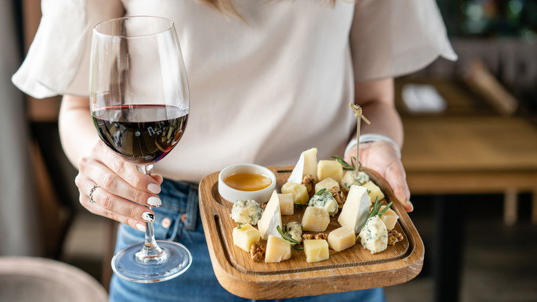 Various cheeses being served