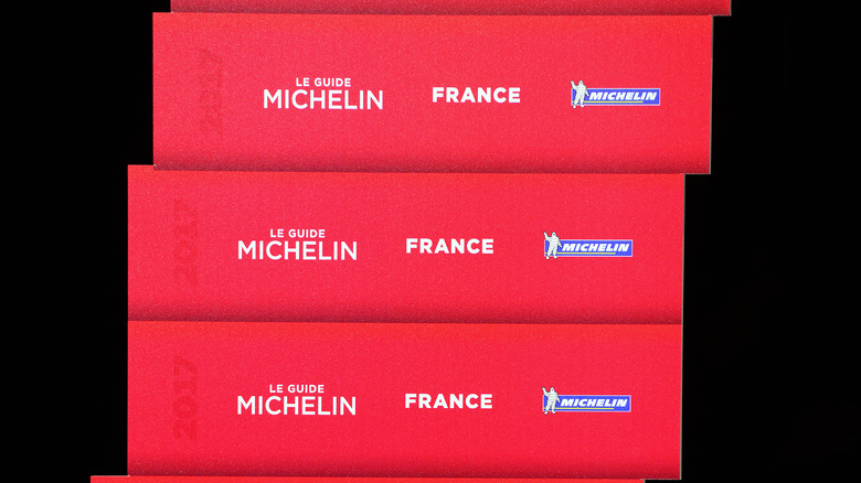 a stack of michelin guides