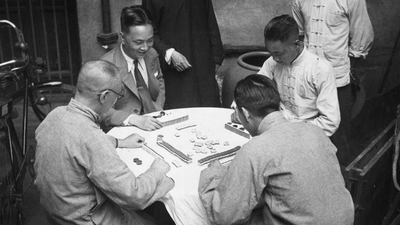 men playing mah jong