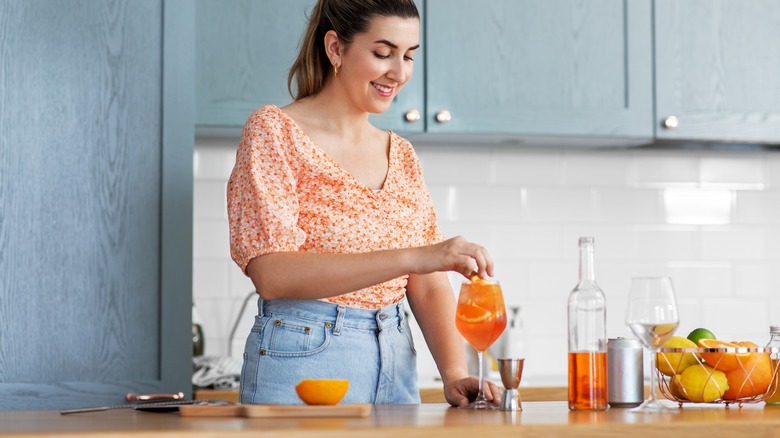 Woman making cocktails 