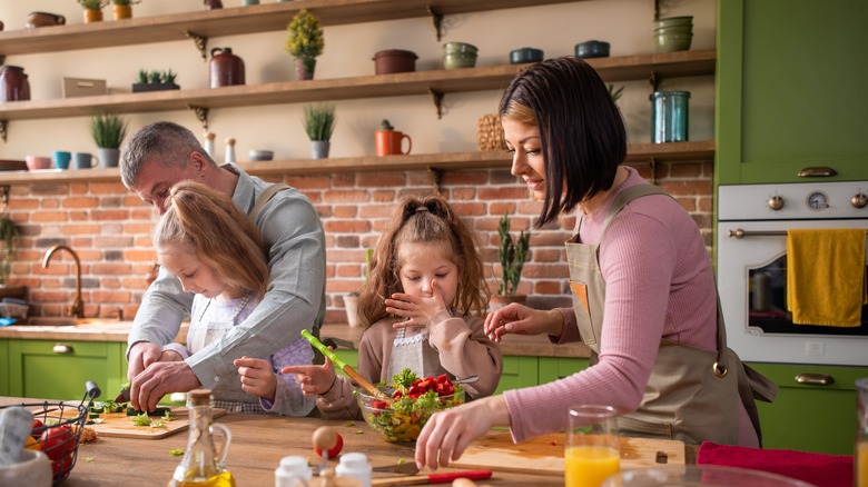 Family preparing vegetables together