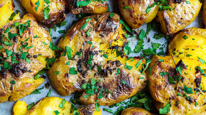 Smashed baked potatoes with parsley