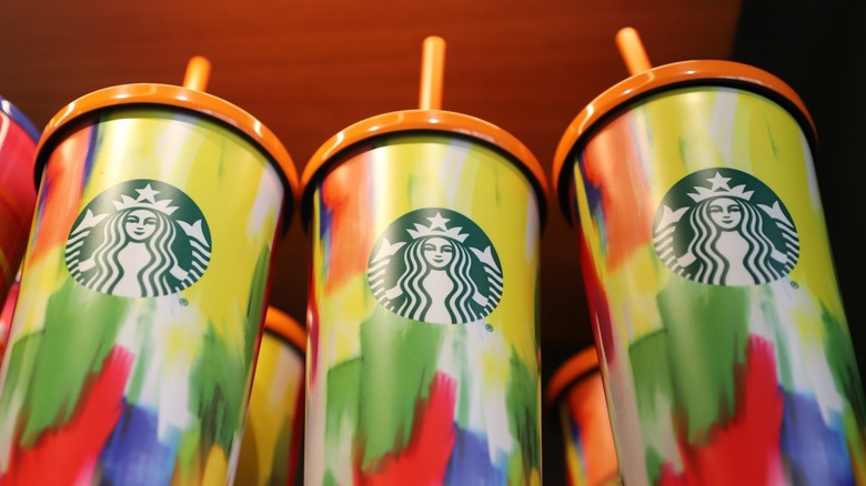 Three colorful Starbucks tumblers