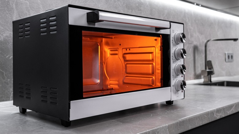 https://www.tastingtable.com/img/gallery/the-reason-toaster-ovens-cook-food-more-slowly-than-microwaves/intro-1656351447.jpg