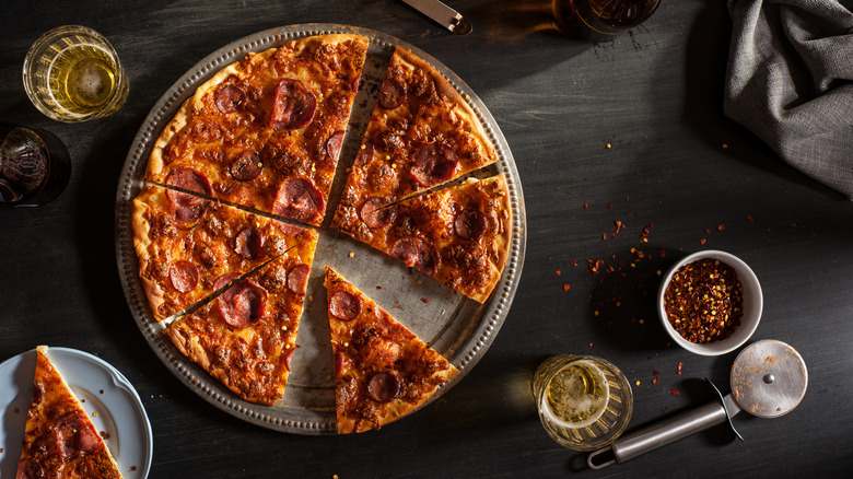 tray of sliced pepperoni pizza