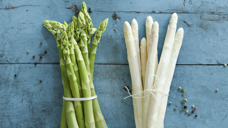 white and green asparagus on table