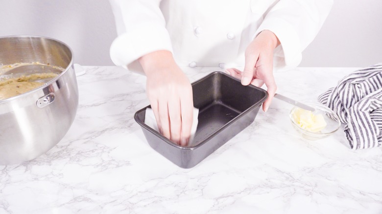 woman making cake in kitchen