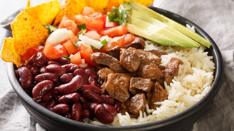 rice bowl with beans, meat, and pico de gallo